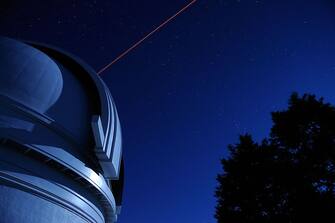 PALOMAR MOUNTAIN, CA - OCTOBER 2008:  On Palomar Mountain in California lies the Hale Telescope, that has been in use for 60 years.  Now added to the telescope is a optics laser that shoots 56 miles upward to help Hale produce sharper and detailed views of galaxies and quasars.  (Photo by Joe McNally/Getty Images)