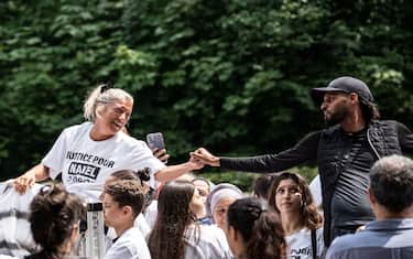 NANTERRE, FRANCE - JUNE 29: Mounia, mother of the French teenager killed by police, attends a memorial march for her son Nahel on June 29, 2023 in Nanterre, France. A French teenager of North African origin was shot dead by police on June 27th, the third fatal traffic stop shooting this year in France - causing nationwide unrest and clashes with police forces. On June 28th, the victim's family called for a memorial march starting at Nanterre's main police station on June 29th. (Photo by Abdulmonam Eassa/Getty Images)