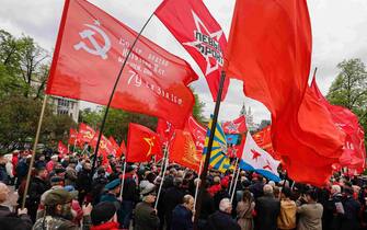 epa10601861 Members of Russian Communist party hold Red flags as they take part in the traditional May Day celebrations near the Karl Marx monument in Moscow, Russia, 01 May 2023. International Workers' Day is an annual holiday that takes place on 01 May and celebrates workers, their rights, achievements and contributions to society.  EPA/SERGEI ILNITSKY