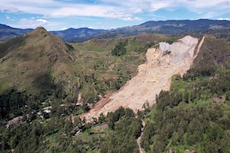 This undated handout photo taken by the UN Development Programme and released on May 28, 2024 shows an aerial view of the site of a landslide at Mulitaka village in the region of Maip Mulitaka, in Papua New Guinea's Enga Province. Papua New Guinea moved to evacuate an estimated 7,900 people from remote villages near the site of a deadly landslide on May 28, as authorities warned of further slips. Some 2,000 people are already feared buried in a landslide that destroyed a remote highland community in the early hours of May 24. (Photo by Handout / UN DEVELOPMENT PROGRAMME / AFP) / RESTRICTED TO EDITORIAL USE - MANDATORY CREDIT "AFP PHOTO / UN DEVELOPMENT PROGRAMME  - NO MARKETING NO ADVERTISING CAMPAIGNS - DISTRIBUTED AS A SERVICE TO CLIENTS - NO ARCHIVE