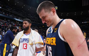 DENVER, CO - FEBRUARY 26: Nikola Jokic #15 of the Denver Nuggets talks with opponent Paul George #13 of the LA Clippers after the game on February 26, 2023 at the Ball Arena in Denver, Colorado. NOTE TO USER: User expressly acknowledges and agrees that, by downloading and/or using this Photograph, user is consenting to the terms and conditions of the Getty Images License Agreement. Mandatory Copyright Notice: Copyright 2023 NBAE (Photo by Garrett Ellwood/NBAE via Getty Images)