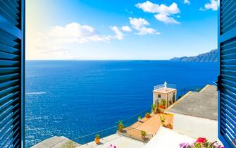 Scenic open window view of the Mediterranean Sea from a luxury resort room along the Amalfi Coast near Sorrento, Italy