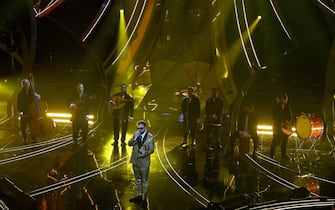 Italian singer Dargen D'Amico with BabelNova Orchestra perform on stage at the Ariston theatre during the 74th Sanremo Italian Song Festival in Sanremo, Italy, 09 February 2024. The music festival runs from 06 to 10 February 2024.   ANSA/RICCARDO ANTIMIANI