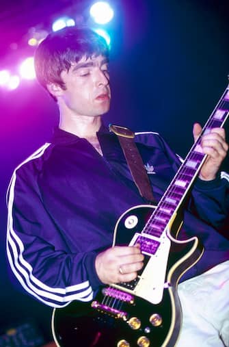 UNITED KINGDOM - AUGUST 18:  ASTORIA  Photo of Noel GALLAGHER and OASIS, Noel Gallagher performing on stage, Gibson Les Paul guitar  (Photo by Mick Hutson/Redferns)