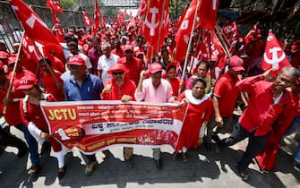 epa11311771 Indian workers and trade union members attend a rally and a meeting to mark the International Workers' Day, in Bangalore, India, 01 May 2024. Labor Day, or May Day, is observed worldwide on 01 May to celebrate the economic and social achievements of workers as well as fight for laborers rights.  EPA/JAGADEESH NV
