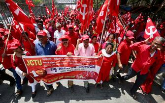 epa11311771 Indian workers and trade union members attend a rally and a meeting to mark the International Workers' Day, in Bangalore, India, 01 May 2024. Labor Day, or May Day, is observed worldwide on 01 May to celebrate the economic and social achievements of workers as well as fight for laborers rights.  EPA/JAGADEESH NV