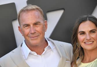 US actor Kevin Costner and his daughter Annie Costner attend the US premiere of "Horizon: An American Saga Chapter 1" at the Regency Village theatre in Westwood, California, June 24, 2024. (Photo by VALERIE MACON / AFP) (Photo by VALERIE MACON/AFP via Getty Images)