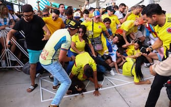 MIAMI GARDENS, FLORIDA - JULY 14: Fans of Colombia and Argentina try to pass the gate amid disturbances the CONMEBOL Copa America 2024 Final match between Argentina and Colombia at Hard Rock Stadium on July 14, 2024 in Miami Gardens, Florida. (Photo by Maddie Meyer/Getty Images)