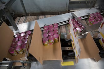Dolores brand tuna cans move along a conveyor belt for packaging at the Grupo Pinsa SA processing plant in Mazatlan, Mexico, on Thursday, Sept. 29, 2015. In April the World Trade Organization (WTO) ruled that dolphin-safe labels for canned tuna discriminated against Mexico. The U.S. has appealed the ruling and a final decision is expected later this year. Photographer: Susana Gonzalez/Bloomberg via Getty Images
