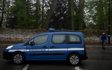 A French gendarme walks near the Parc de la Corbie amid investigations after a missing person report was released by the French gendarmerie for Chloe, 20 years-old, who went missing while jogging on the morning of April 21, 2023, in Dammartin-en-Goele, northeastern of Paris on April 22, 2023. (Photo by JULIEN DE ROSA / AFP) (Photo by JULIEN DE ROSA/AFP via Getty Images)