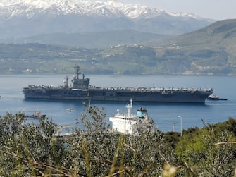 epa09085423 The nuclear-powered aircraft carrier USS Eisenhower arrived at the naval base of Marathi, Crete, Greece, 20 March 2021. The US aircraft carrier has a 5,600 crew members and can carry 90 fighter jets and helicopters.  EPA/ZARPANEWS