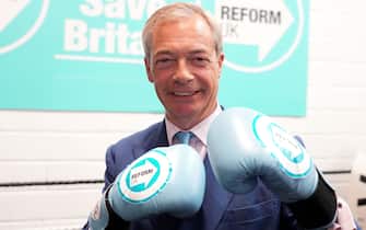 Reform UK leader Nigel Farage wearing boxing gloves at a boxing gym in Clacton, Essex, while on the General Election campaign trail. Picture date: Wednesday July 3, 2024.