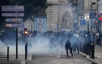 epa10719808 People clash with riot police during a  demonstration in memory of 17-year-old Nahel who was killed by French Police in Marseille, France, 30 June 2023. 
Violence broke out all over France after police fatally shot a 17-year-old teenager during a traffic stop in Nanterre on 27 June.  EPA/Sebastien Nogier
