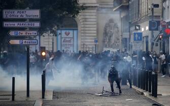 epa10719808 People clash with riot police during a  demonstration in memory of 17-year-old Nahel who was killed by French Police in Marseille, France, 30 June 2023. 
Violence broke out all over France after police fatally shot a 17-year-old teenager during a traffic stop in Nanterre on 27 June.  EPA/Sebastien Nogier