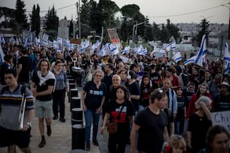 Demonstrators march, beat drums, sing and wave Israeli flags in a demonstration for the kidnapping deal near the Knesset, on March 31, 2024, in Jerusalemm Israel. (Photo by Yahel Gazit / Middle East Images / Middle East Images via AFP) (Photo by YAHEL GAZIT/Middle East Images/AFP via Getty Images)