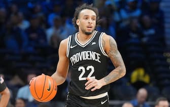 PHILADELPHIA, PA - FEBRUARY 04:  Devin Carter #22 of the Providence Friars dribbles up court during a college basketball game against the Villanova Wildcats at Wells Fargo Center on February 4, 2024 in Philadelphia, Pennsylvania.  (Photo by Mitchell Layton/Getty Images)