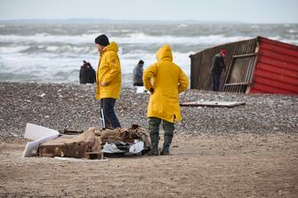 epa11044606 Locals inspect items from containers spillage  along the West coast at Tranum beach in North Jutland, Denmark, 26 December 2023. The contents of 46 lost containers from the ship Mayview Maersk wash ashore in North Jutland. The containers washed overboard during storm Pia.  EPA/Claus Bjoern Larsen  DENMARK OUT