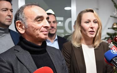 France's far-right party "Reconquete" leader Eric Zemmour (L) and Executive Vice President of "Reconquete" Marion Marechal  talk to the press during the inauguration of the party's campaign headquarters in Paris on December 11, 2023. (Photo by Bertrand GUAY / AFP) (Photo by BERTRAND GUAY/AFP via Getty Images)