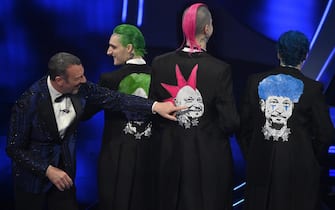 Sanremo Festival host and artistic director Amadeus (L) and Italian band La Sad on stage at the Ariston theatre during the 74th Sanremo Italian Song Festival in Sanremo, Italy, 07 February 2024. The music festival runs from 06 to 10 February 2024.   ANSA/RICCARDO ANTIMIANI