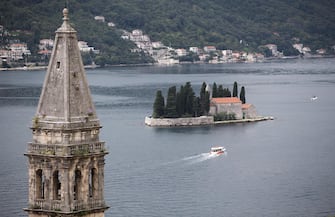 epa07890237 A boat sails on Kotor bay near Sveti Dorde island in front of Perast disrict in Kotor, Montenegro, 02 October 2019.  EPA/ERDEM SAHIN