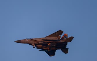 An Israeli army f-15 fighter jet flies over central Israel on April 15, 2024. (Photo by Menahem KAHANA / AFP)