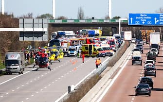 27 March 2024, Saxony, Schkeuditz: Emergency vehicles and rescue helicopters are at the scene of the accident on the A9. At least one person has died in an accident involving a coach on the A9 near Leipzig. According to police reports on Wednesday, there were also several injuries. (to dpa: "At least one dead in an accident involving a coach on the A9 near Leipzig") Photo: Jan Woitas/dpa (Photo by Jan Woitas/picture alliance via Getty Images)