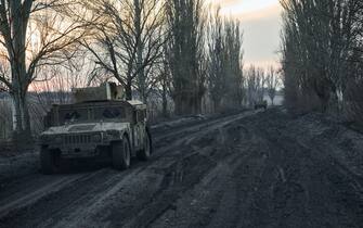 AVDIIVKA DISTRIKT, UKRAINE - FEBRUARY 14: Vehicles on the mud road to the city, the outskirts of Avdiivka on February 14, 2024 in Avdiivka district, Ukraine. Both Ukraine and Russia have recently claimed gains in the Avdiivka, where Russia is continuing a long-running campaign to capture the city, located in the Ukraine's eastern Donetsk Region. Last week, the Russian army was successful in advancing towards the city and captured the main supply road. (Photo by Kostiantyn Liberov/Libkos/Getty Images)