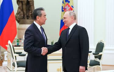 Russian President Vladimir Putin meets with China's Director of the Office of the Central Foreign Affairs Commission Wang Yi at the Kremlin in Moscow on February 22, 2023. (Photo by Anton Novoderezhkin / SPUTNIK / AFP) (Photo by ANTON NOVODEREZHKIN/SPUTNIK/AFP via Getty Images)