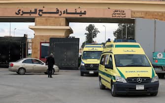 epa10985481 Ambulances cross the Rafah border crossing between the Gaza Strip and Egypt, in Rafah, Egypt, 19 November 2023. More than 11,700 Palestinians and at least 1,200 Israelis have been killed, according to the Israel Defense Forces (IDF) and the Palestinian health authority, since Hamas militants launched an attack against Israel from the Gaza Strip on 07 October, and the Israeli operations in Gaza and the West Bank which followed it.  EPA/KHALED ELFIQI
