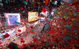 NEW YORK, NY - JANUARY 1: Confetti falls on revelers during New Year's Eve festivites in Times Square on January 1, 2024, in New York City. (Photo by Gary Hershorn/Getty Images)
