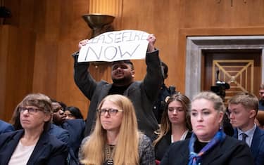 A protester shouts as he interrupts the nomination hearing of Jacob Lew before the Senate Foreign Relations Committee to be US Ambassador to Israel on October 18, 2023 at the US Capitol in Washington, DC. (Photo by ROBERTO SCHMIDT / AFP) (Photo by ROBERTO SCHMIDT/AFP via Getty Images)