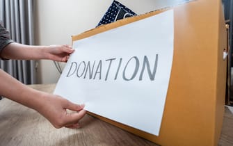 A woman put "Donate" message on the card box.