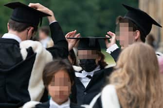 Students from King's College prepare for the procession to Senate House for their graduation ceremony at the University of Cambridge. Picture date: Wednesday June 30, 2021.