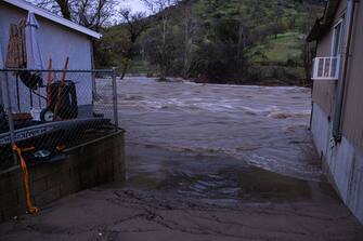 SPRINGVVILLE, CA - MARCH 10: Damaged homes and property are seen in the aftermath of a flash flood on March 10, 2023 near Springville, California. Another in a series of atmospheric river storms from the Pacific Ocean has brought a warm rain to the region, which is falling on top of, and melting, large areas of snow in the Sierra Nevada Mountains, increasing the risk of floods at lower elevations. This years  destructive and deadly storms have produced heavy rains and a near-record snowpack in the Sierras, which provides water for millions of Californians. As a result of one of Californias wettest winters on record, most of the state has gotten relief from years of drought. (Photo by David McNew/Getty Images)
