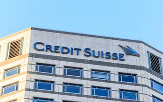 Sign at the top of the Credit Suisse building in the financial district of London, UK