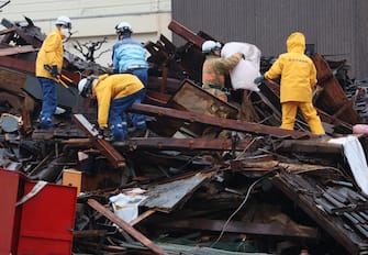 epa11054274 Rescue workers search for missing people in the earthquake-devastated city of Wajima, Ishikawa Prefecture, central Japan, 03 January 2024. The Ishikawa Prefecture Government has announced 62 people were killed by the magnitude 7 earthquake (the USGS listed the magnitude as 7.5) which occured on 01 January. About 33,000 residents in Ishikawa Prefecture have evacuated to 355 makeshift evacuation centers. According to Hokuriku Electric Power Company, about 33,900 homes lost electricity in the prefecture.  EPA/JIJI PRESS JAPAN OUT EDITORIAL USE ONLY/