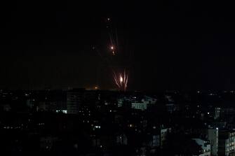 epa10914126 Rockets are launched from the coastal Gaza strip towards Israel by militants of the Ezz Al-Din Al Qassam militia, the military wing of Hamas movement, in Gaza City, on, 11 October 2023. More than 1,000 Palestinians have been killed and over 5,000 others injured, according to the Palestinian Ministry of Health, after Israel started bombing the Palestinian enclave in response to attacks carried out by the Islamist movement Hamas on Israel from the Gaza Strip on 07 October. More than 3,000 people, including 1,500 militants from Hamas, have been killed and thousands injured in Gaza and Israel since 07 October, according to Israeli military sources and Palestinian officials.  EPA/MOHAMMED SABER