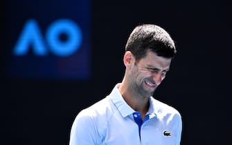 epa11104824 Novak Djokovic of Serbia reacts against Jannik Sinner of Italy during the Menâ  s semifinal  on Day 13 of the 2024 Australian Open at Melbourne Park in Melbourne, Austraila, 26 January 2024.  EPA/JOEL CARRETT NO ARCHIVING, EDITORIAL USE ONLY AUSTRALIA AND NEW ZEALAND OUT