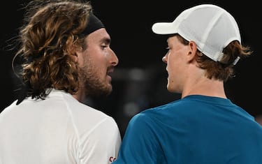 Greece's Stefanos Tsitsipas greets Italy's Jannik Sinner after winning their men's singles match on day seven of the Australian Open tennis tournament in Melbourne on January 22, 2023. - -- IMAGE RESTRICTED TO EDITORIAL USE - STRICTLY NO COMMERCIAL USE -- (Photo by Paul CROCK / AFP) / -- IMAGE RESTRICTED TO EDITORIAL USE - STRICTLY NO COMMERCIAL USE -- (Photo by PAUL CROCK/AFP via Getty Images)
