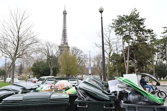 PARIS, FRANCE - MARCH 13: Garbage cans overflowing with trash on the streets as collectors go on strike in Paris, France on March 13, 2023. Garbage collectors have joined the massive strikes throughout France against pension reform plans. (Photo by Mustafa Yalcin/Anadolu Agency via Getty Images)
