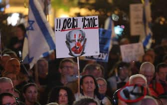 epa11092449 A protester holds a signt depicting Israeli Prime Minister Benjamin Netanyahu with the words 'Responsible' and 'Guilty' in Hebrew during a demonstration against the government in Habima square in Tel Aviv, Israel , 20 January 2023. More than 24,700 Palestinians and at least 1,300 Israelis have been killed, according to the Palestinian Health Ministry and the Israel Defense Forces (IDF), since Hamas militants launched an attack against Israel from the Gaza Strip on 07 October, and the Israeli operations in Gaza and the West Bank which followed it.  EPA/ABIR SULTAN