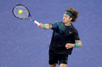 DUBAI, UNITED ARAB EMIRATES - MARCH 01: Andrey Rublev plays a forehand against Alexander Bublik of Kazakhstan in their semifinal match during the Dubai Duty Free Tennis Championships at Dubai Duty Free Tennis Stadium on March 01, 2024 in Dubai, United Arab Emirates. (Photo by Christopher Pike/Getty Images)