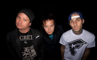 READING, UNITED KINGDOM - AUGUST 29:  Tom Delonge, Mark Hoppus, Travis Barker (R) of Blink 182 pose for a photoshoot on August 29, 2010 in Reading, England.  (Photo by Nigel Crane/Redferns)