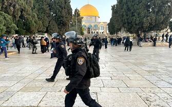 Israeli police walk inside the Al-Aqsa mosque compound in Jerusalem, the holy Muslim site built on top of what Jews call the Temple Mount, Judaism's holiest site, early on April 5, 2023 after clashes erupted during Islam's holy month of Ramadan. - Israeli police said they had entered to dislodge "agitators", a move denounced as an "unprecedented crime" by the Palestinian Islamist movement Hamas. (Photo by Ahmad GHARABLI / AFP) (Photo by AHMAD GHARABLI/AFP via Getty Images)