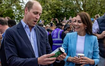 epa10613731 Britain's Catherine, Princess of Wales (C-R) and William, Prince of Wales (C-L) visit the Coronation Big Lunch in Windsor, Britain, 07 May 2023, following the coronation of Britain's King Charles III at Westminster Abbey in London on 06 May.  EPA/MARTIN DIVISEK