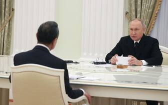 Russian President Vladimir Putin meets with China's Director of the Office of the Central Foreign Affairs Commission Wang Yi at the Kremlin in Moscow on February 22, 2023. (Photo by Anton Novoderezhkin / SPUTNIK / AFP) (Photo by ANTON NOVODEREZHKIN/SPUTNIK/AFP via Getty Images)