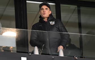 BURSLEM, ENGLAND - JANUARY 27: New Port Vale President and Pop Star Robbie Williams watches play during the Sky Bet League One match between Port Vale and Portsmouth at Vale Park on January 27, 2024 in Burslem, England. (Photo by Gareth Copley/Getty Images)