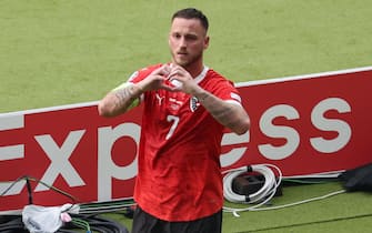 epa11428747 Marko Arnautovic of Austria celebrates after scoring the 1-3 during the UEFA EURO 2024 group D soccer match between Poland and Austria, in Berlin, Germany, 21 June 2024.  EPA/ABEDIN TAHERKENAREH