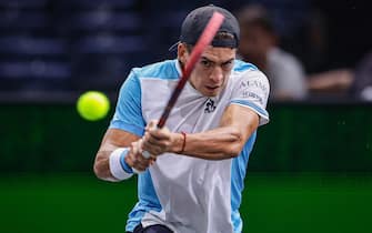 epa10949459 Sebastian Baez of Argentina in action against Taylor Fritz of the US during their first round match at the Rolex Paris Masters tennis tournament in Paris, France, 30 October 2023.  EPA/CHRISTOPHE PETIT TESSON