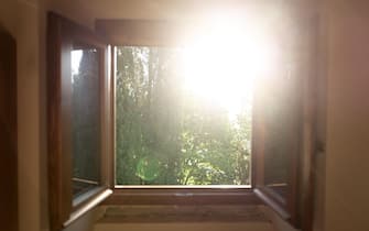 Window sunrise in a countryhouse of Tuscany Italy